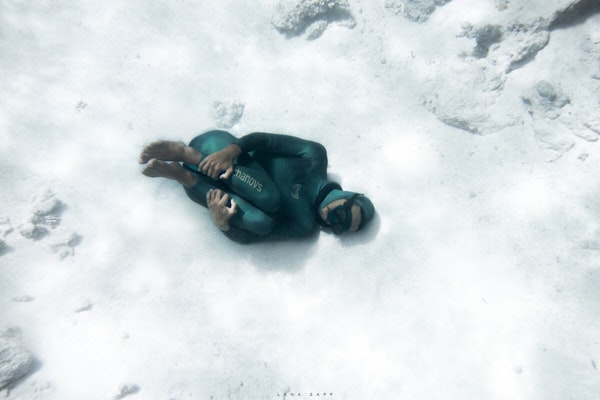 Freediver connecting with the ocean - Lana Zapp Photography