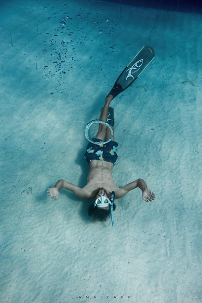 Freediver blowing bubble ring - Lana Zapp Photography