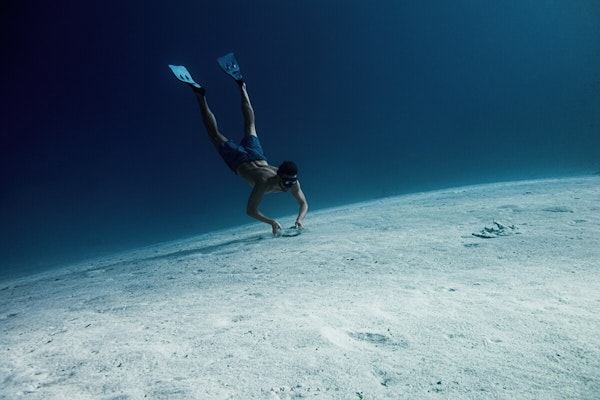 Freediver Landing on Sea Bottom - Lana Zapp Photography